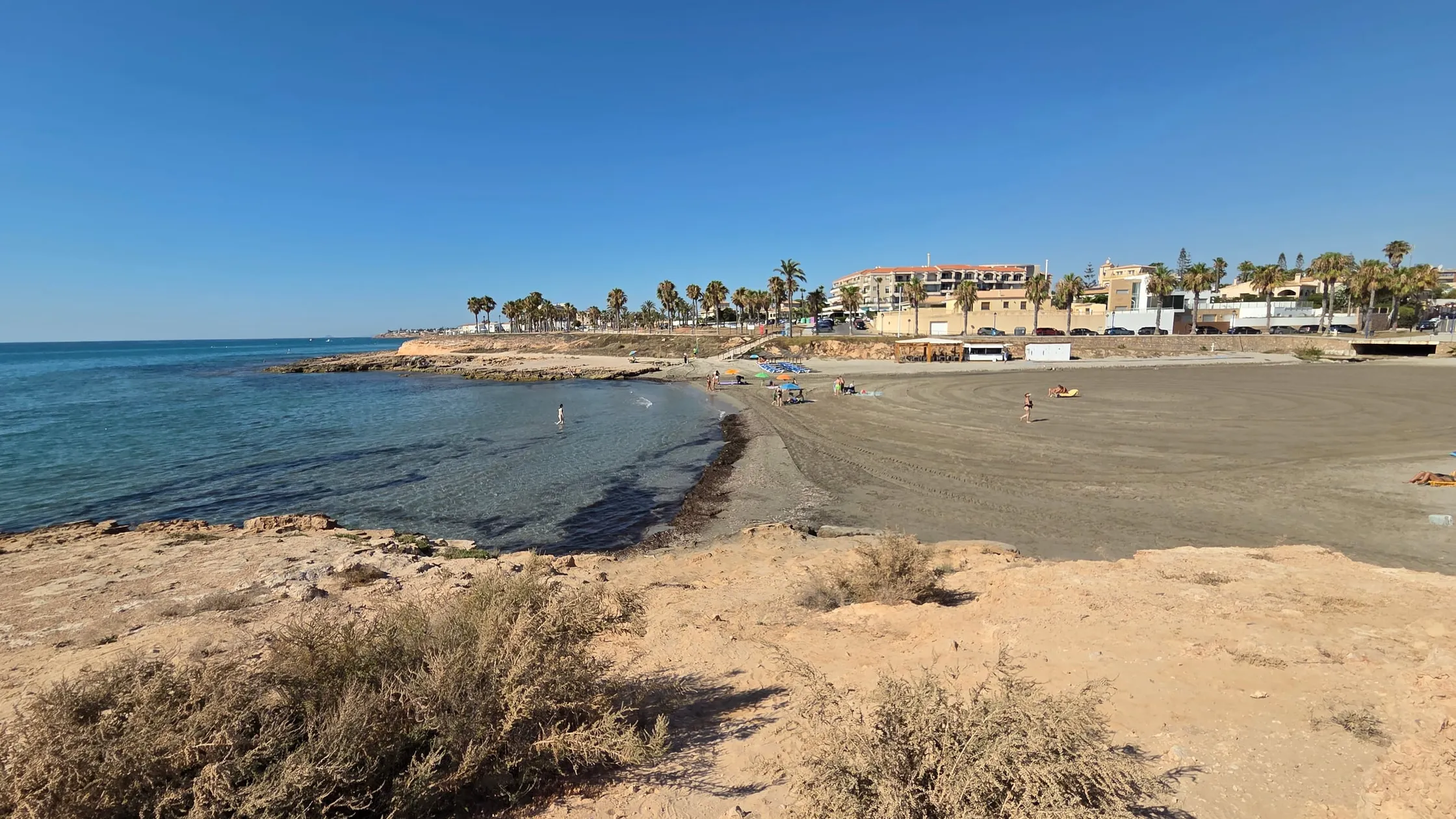 Cala Mosca, a small rocky-edged cove in the Playa Flamenca area