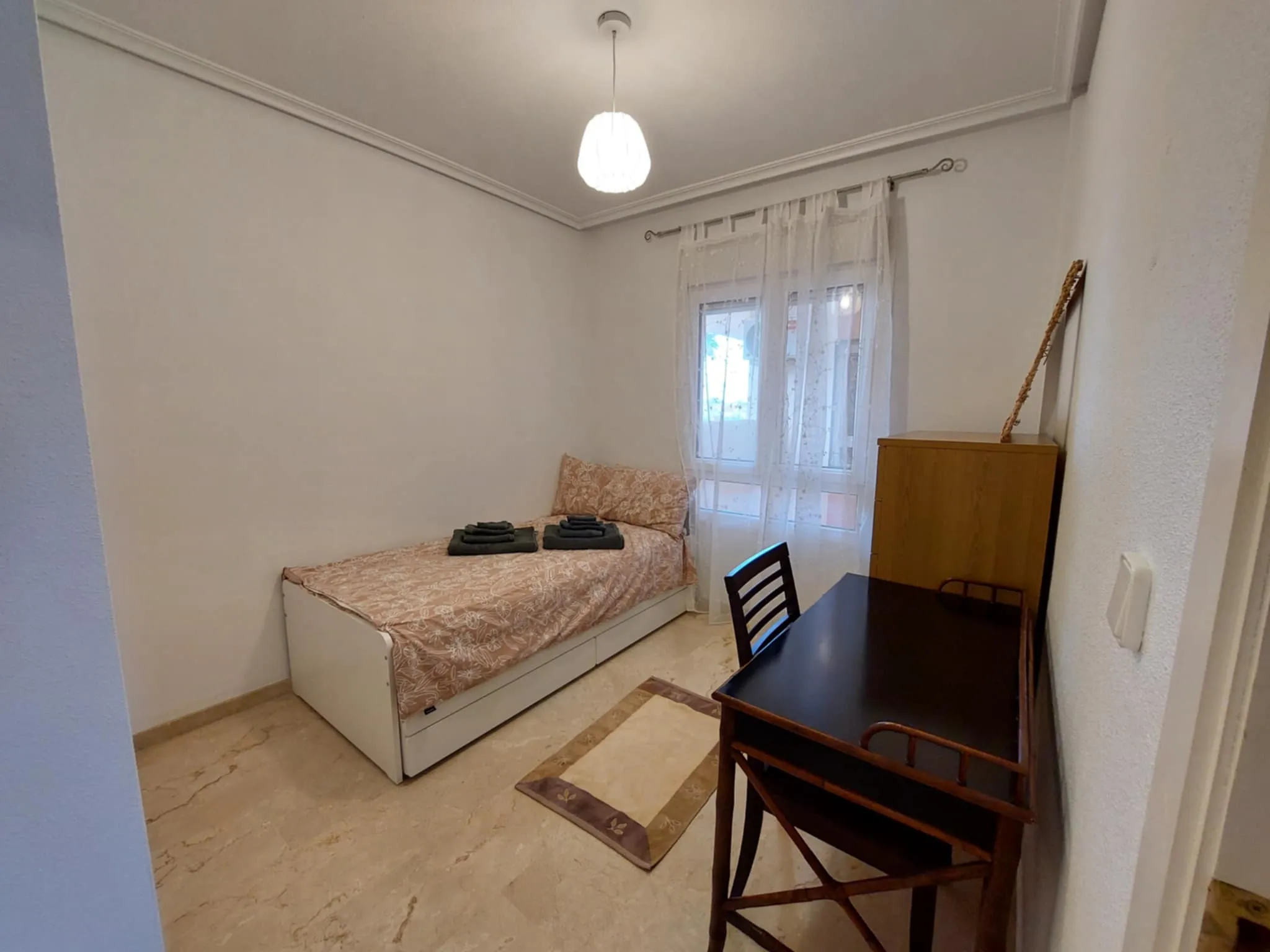 Second bedroom with single bed and desk