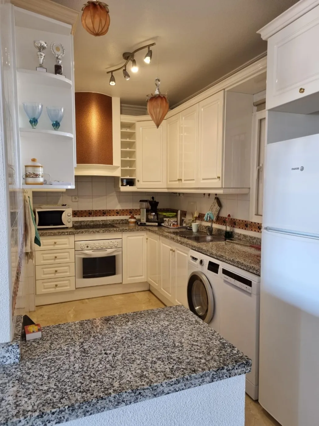 Fitted kitchen with oven, fridge and washing machine