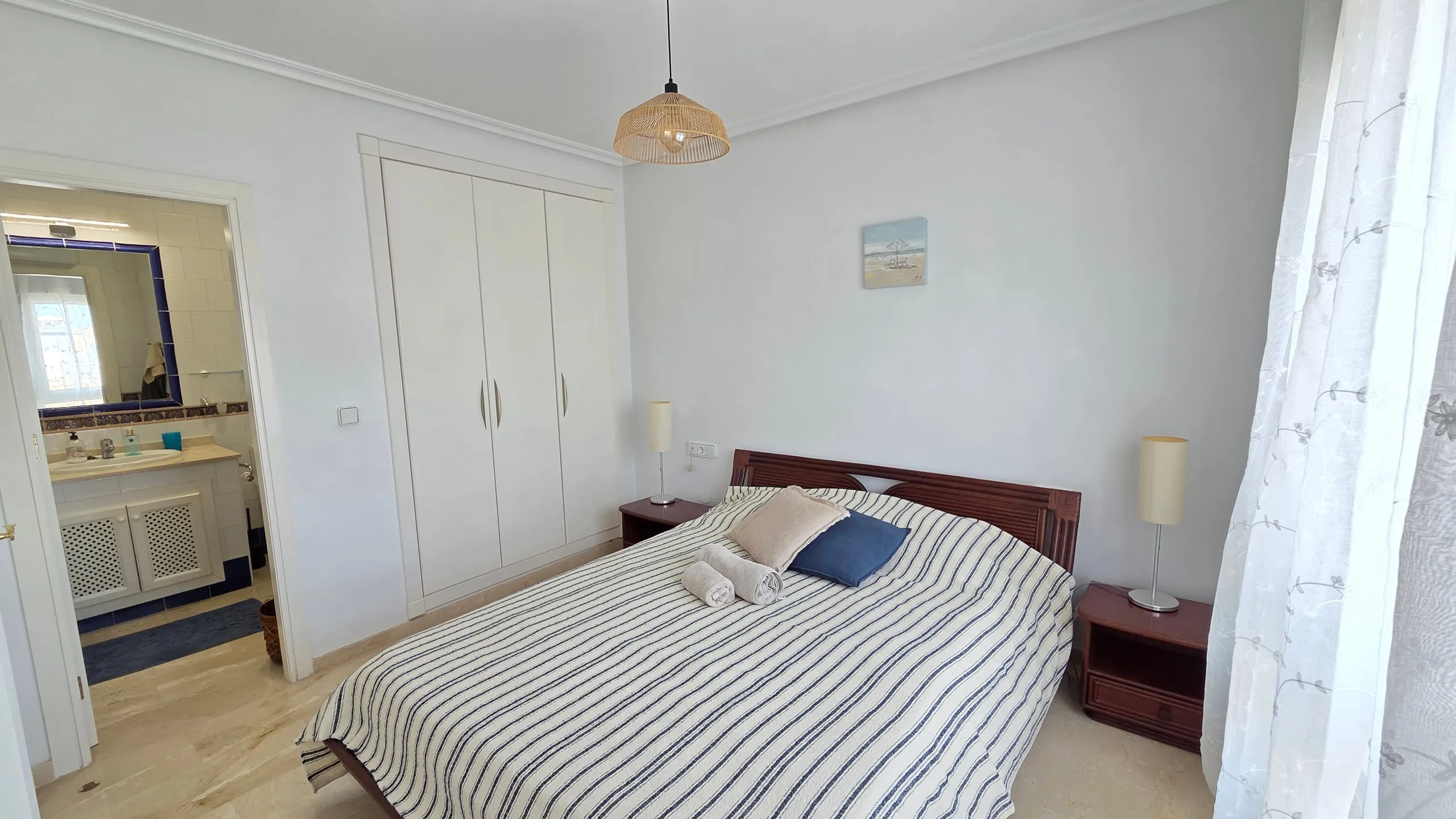 Main bedroom with built-in wardrobes and en-suite bathroom